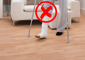 Person on crutches. Picture is indicating that he is not allowed to put any weight on his injured leg.